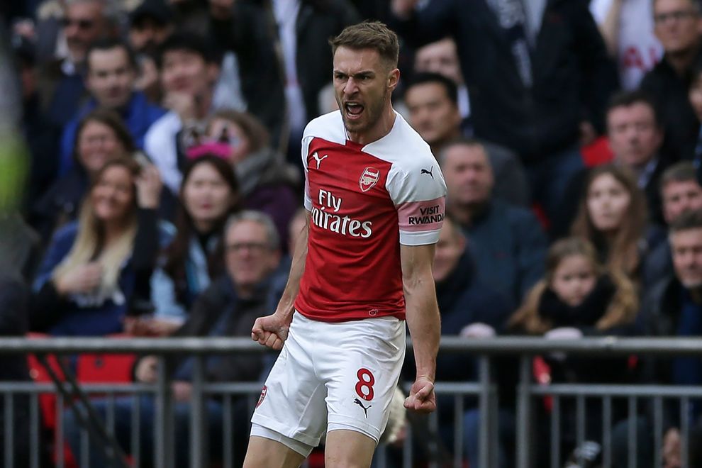 Arsenal's Welsh midfielder Aaron Ramsey celebrates after scoring the opening goal of the English Premier League football match between Tottenham Hotspur and Arsenal at Wembley Stadium in London, on March 2, 2019. (Photo by Daniel LEAL-OLIVAS / AFP) / RESTRICTED TO EDITORIAL USE. No use with unauthorized audio, video, data, fixture lists, club/league logos or 'live' services. Online in-match use limited to 120 images. An additional 40 images may be used in extra time. No video emulation. Social media in-match use limited to 120 images. An additional 40 images may be used in extra time. No use in betting publications, games or single club/league/player publications. /